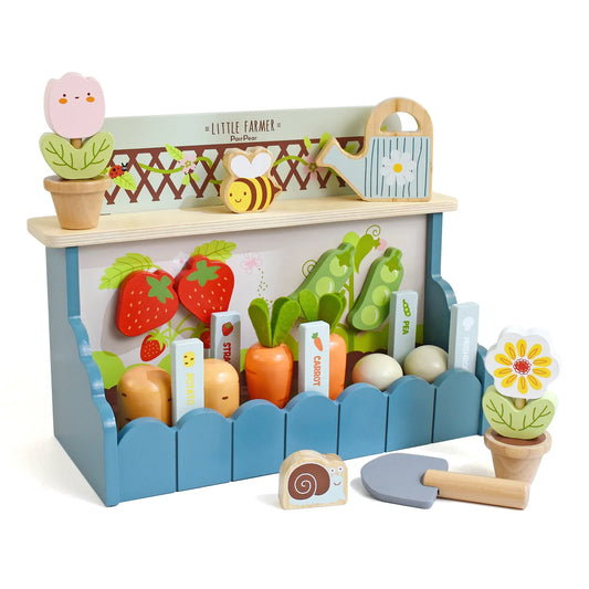 Kids wooden little farmer playset. This pretend play garden toy features planting vegetables, carrots, strawberries, and flowers on a wooden stand.