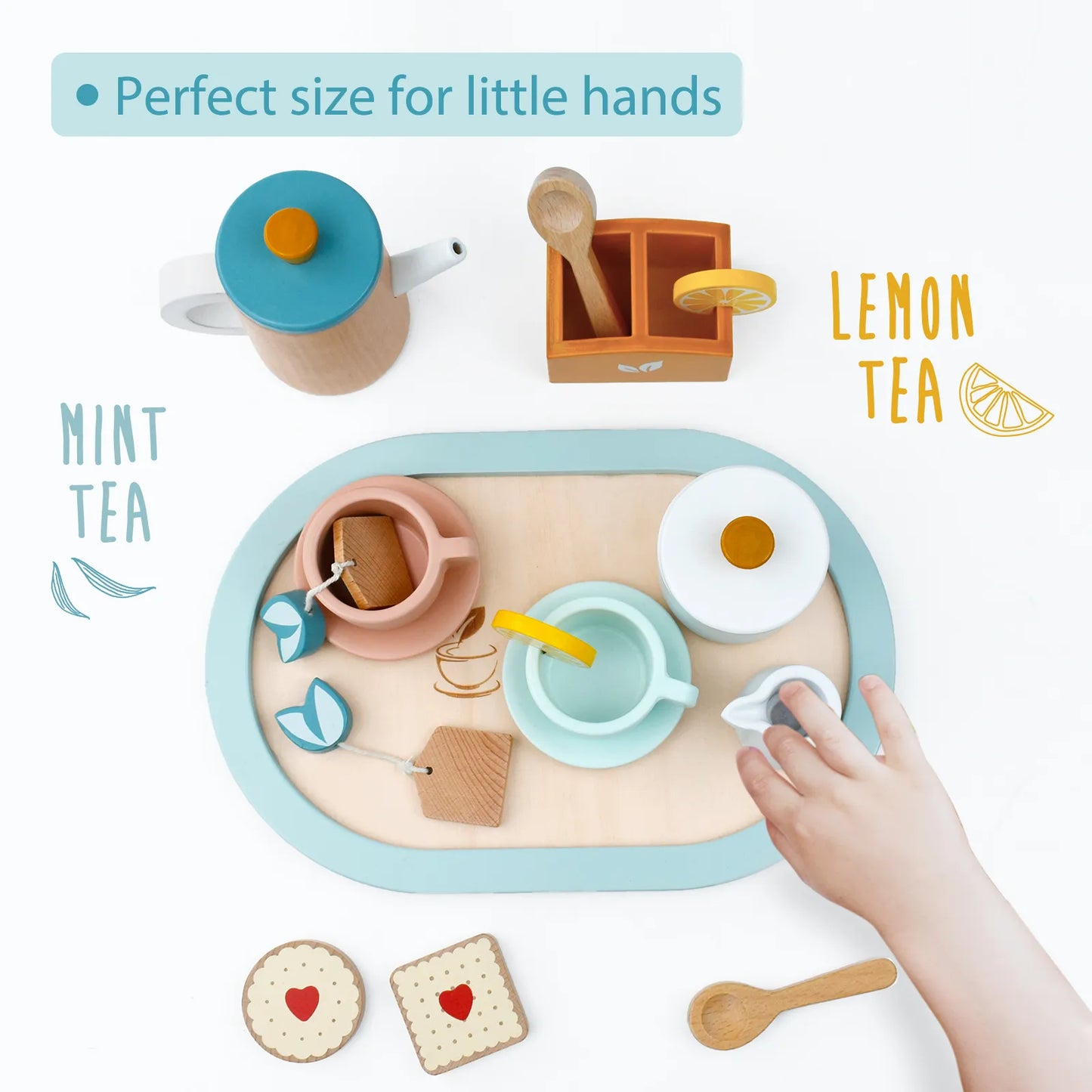 Toddler playing with a wooden tea party set. Perfect size for little hands, this pretend play kit lets kids enjoy imaginary mint and lemon tea.