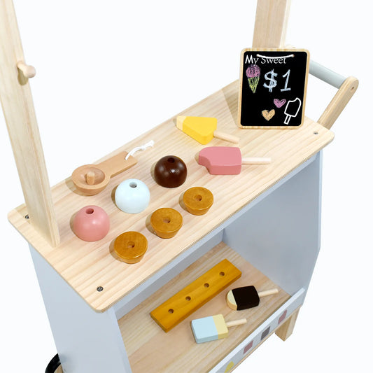 Top-down view of a kids wooden ice cream cart toy. Features pretend play food like colorful popsicles, ice cream scoops, and a mini chalkboard.