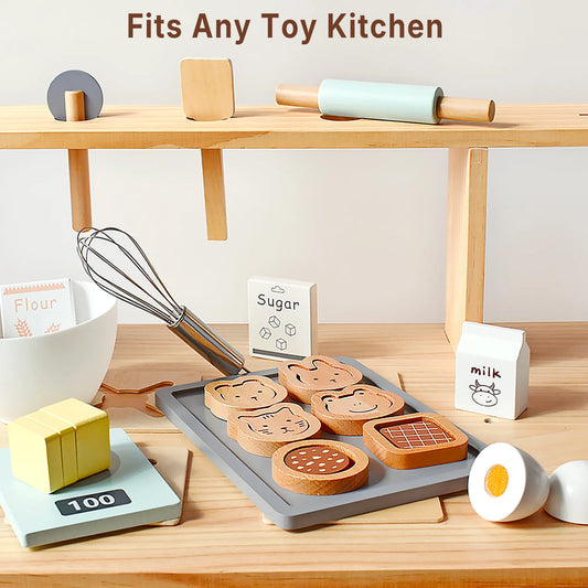Wooden baking toy set perfectly fitting a play kitchen. This pretend play food kit features animal cookies, a whisk, scale, and toy ingredients.
