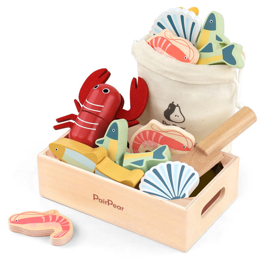 PairPear wooden pretend play food set displayed in a branded wooden crate and canvas bag. Includes toy lobster, fish, shrimp, and scallop