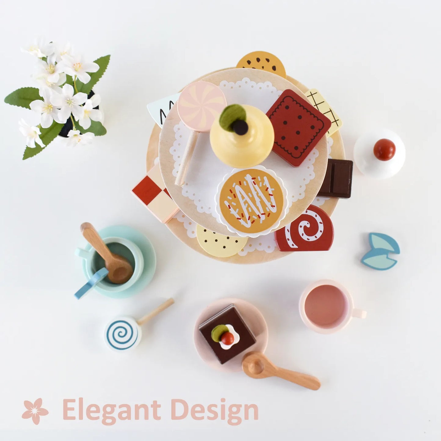 Top view of an elegant wooden tea party set for toddlers, featuring a tiered cake stand filled with beautifully painted pretend play desserts