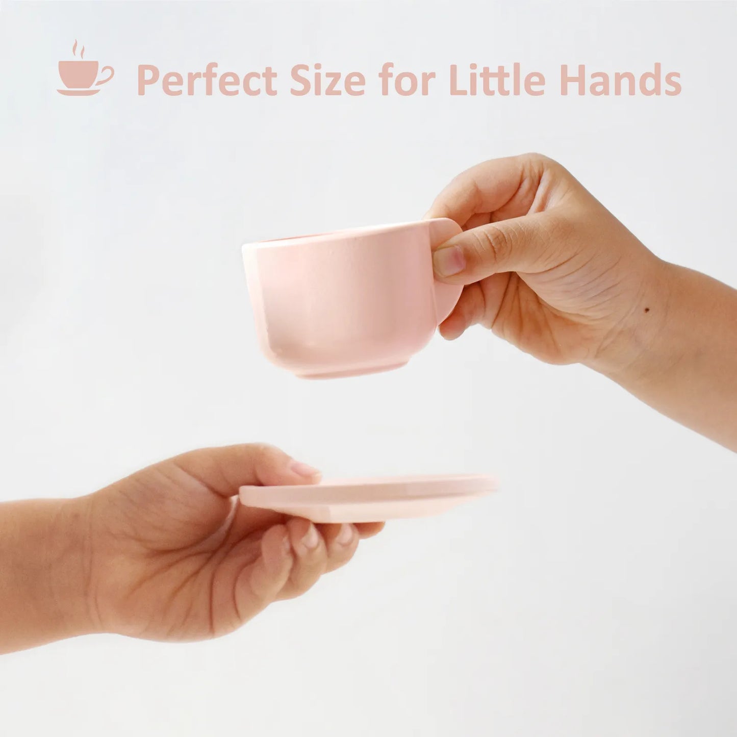 Child holding a pink wooden teacup and saucer. This pretend play tea set is the perfect size for little hands to develop fine motor skills